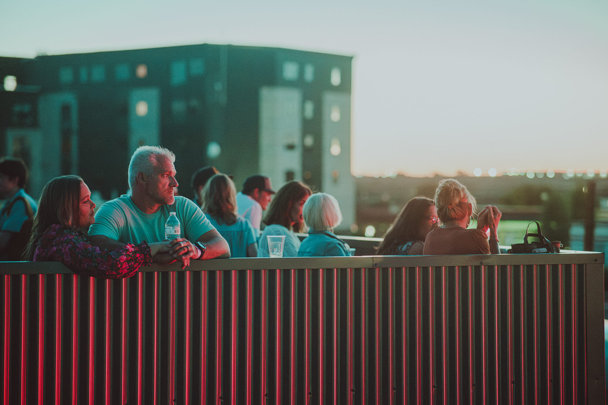 Guests watching sunset from The Gaslight Social rooftop