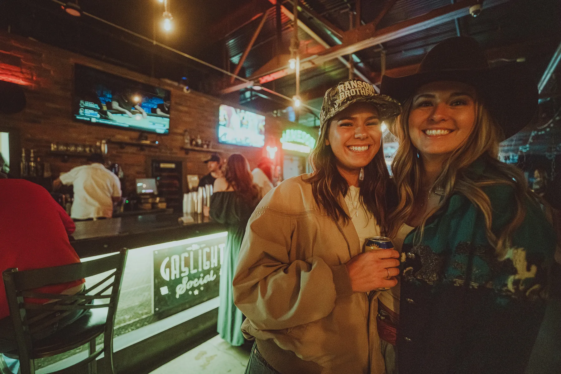 Friends together beside The Gaslight Social bar